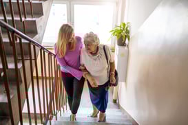 Elderly Woman Being Helped Up Stairs (002)